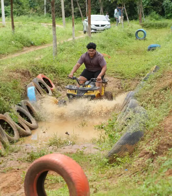 Person riding an ATV bike on rugged adventure trail